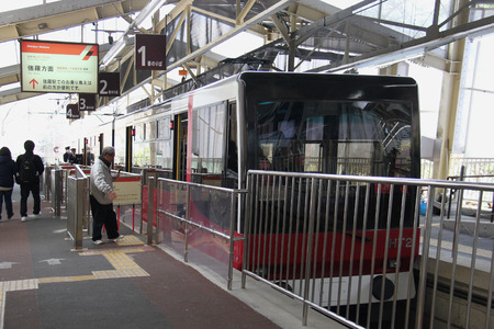 Hakone, Japan - April 9, 2015: Hakone Tozan Cable Car, a funicular railway racing effortlessly up the steep slope in Hakone, is serving passengers from Gora Station to Sounzan Station. Hakone, Japan - April 9, 2015: Hakone Tozan Cable Car, a funicular railway racing effortlessly up the steep slope in Hakone, is serving passengers from Gora Station to Sounzan Station.
