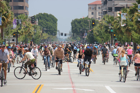 Pasadena, California, USA - May 31, 2015: CicLAvia is an event held in Los Angeles where streets are closed to motor vehicles and open for the public to walk, bike and skate through open streets. Pasadena, California, USA - May 31, 2015: CicLAvia is an event held in Los Angeles where streets are closed to motor vehicles and open for the public to walk, bike and skate through open streets.
