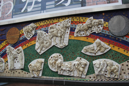 Tokyo, Japan - April 13, 2015: Wall Decoration about Hachiko, an Akita dog which is remembered for his remarkable loyalty to his owner, at the Shibuya Station.のeditorial素材