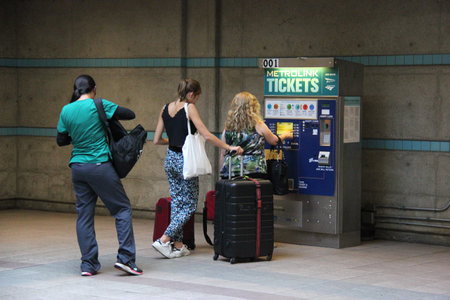 Los Angeles, California, USA - August 14, 2015: Passengers are purchasing train tickets from vending...