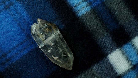 Black phantom quartz on wool background with space for write wording, rare item lucky stone  for decorating for making accessories such as bracelet with belief of lucky, health, wealthy and meditationの写真素材