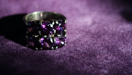 jewelry-silver-ring-with-purple-sapphire-on-violet-background and have space for write wording, value popular accessory for men and womenの写真素材