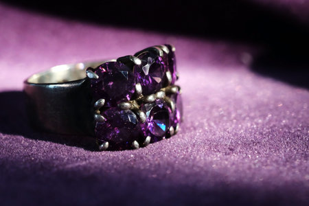 jewelry-silver-ring-with-purple-sapphire-on-violet-background and have space for write wording, value popular accessory for men and womenの写真素材