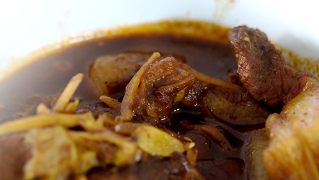 Thai northern style pork curry, Hung Ley, and space for write wording, unique style special recipe curry, full of lipid from pork, seems unhealthy from fat cause of heart disease and other illnessの写真素材