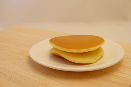 Dora-yaki, popular Japanese pancake with sweet red bean and space for write wording, served with coffee or tea in morning or coffee time, sold in coffee shop, market and department storeの写真素材