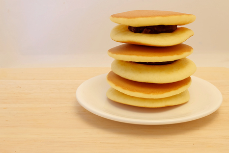 Dora-yaki, popular Japanese pancake with sweet red bean and space for write wording, served with coffee or tea in morning or coffee time, sold in coffee shop, market and department storeの写真素材