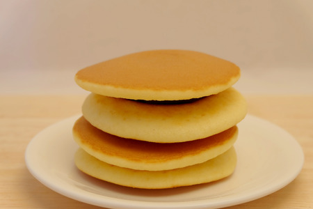 Dora-yaki, popular Japanese pancake with sweet red bean and space for write wording, served with coffee or tea in morning or coffee time, sold in coffee shop, market and department storeの写真素材