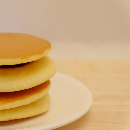 Dora-yaki, popular Japanese pancake with sweet red bean and space for write wording, served with coffee or tea in morning or coffee time, sold in coffee shop, market and department storeの写真素材