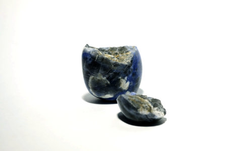 Isolated picture of broken lucky stone on white background, devalue and unlucky object, with space...