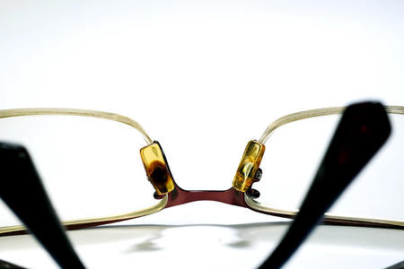 Isolate photo of old dirty damage eyeglasses with space for write wording, dangerous eye ware high risk of infection, major cause of blindness that affect quality of living, economy and health problemの写真素材