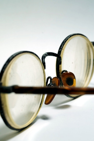 Isolate photo of old dirty damage eyeglasses with space for write wording, dangerous eye ware high risk of infection, major cause of blindness that affect quality of living, economy and health problemの写真素材