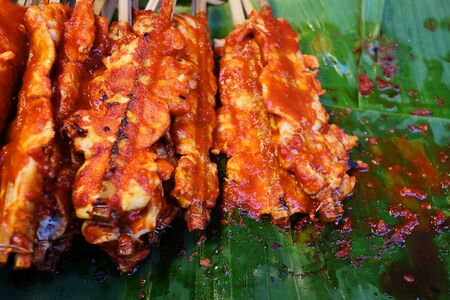 Grilled chicken with sauce, popular street food always found in Bangkok, Thailand and have space for write wording. Unhealthy food from dirt and carcinogen cause of cancer. Buy and eat carefullyの写真素材