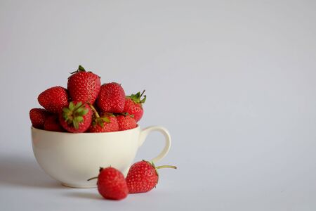 Isolated photo of Strawberry in white cup and space for write wordingの写真素材