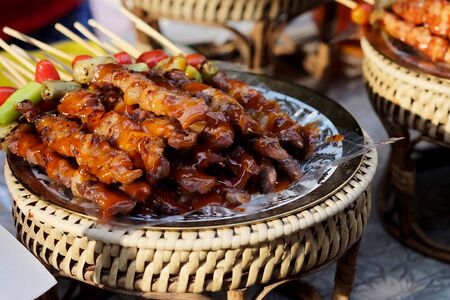 Grilled beef, chicken and sausage with space for write wording. Street food is unique dining lifestyle in Bangkok, Thailand, Unhealthy from dust and dirtiness cause illness such as diarrhea.の写真素材