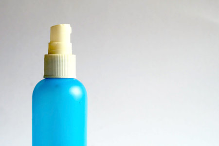 Isolate of blue spray bottle on white background, alcohol bottle for preventing virus infection in...