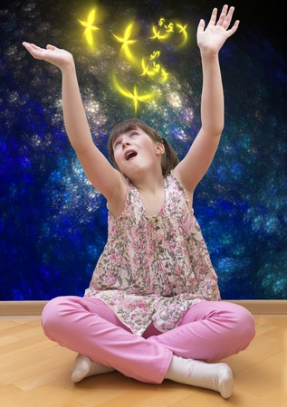 Girl meditating on abstract backgroundの写真素材