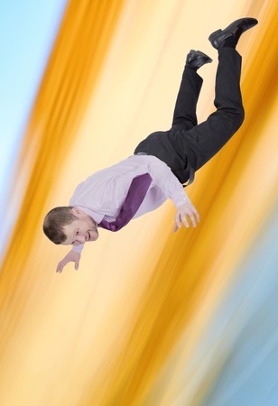 Businessman falling down with abstract backgroundの写真素材