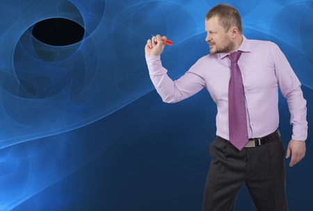 Businessman aiming by dart on abstract backgroundの写真素材