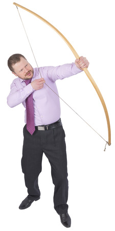 Businessman practicing archery on white backgroundの写真素材