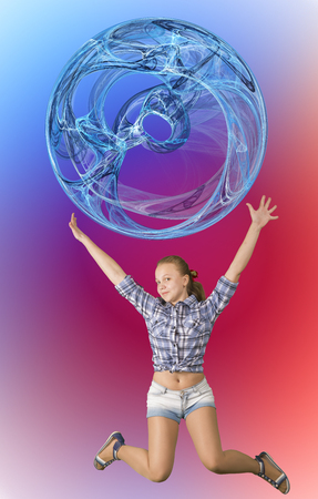 Beautiful teen girl jumping with ball abstract sphereの写真素材