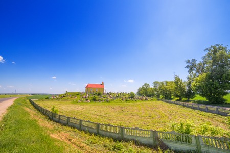 Church fence road summer landscape green fieldの写真素材