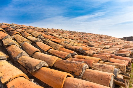Old tile roof close up ceramic texture skyの写真素材