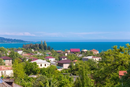Coastal village aerial view village town sea landscape roofの写真素材