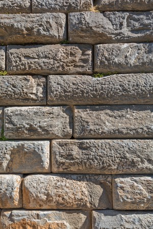 Natural old stone wall texture ancient buildingの写真素材