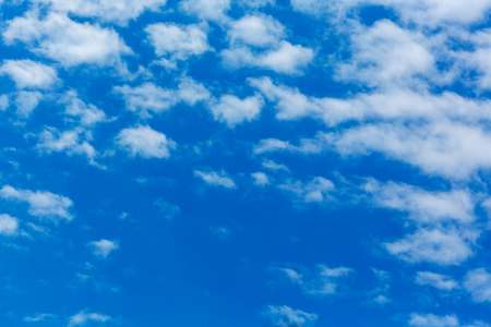 Peaceful white clouds at deep blue skyの写真素材