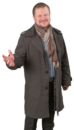 Middle-aged man in a coat and scarf looking friendly on white background isolatedの写真素材