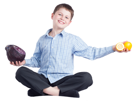 Young boy with healthy food on white backgroundの写真素材