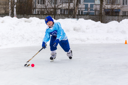 RUSSIA, KOROLEV- FEBRUARY 18, 2017: Young hockey player have a warm up training before the match on bandy tournament in Korolev, Russiaのeditorial素材