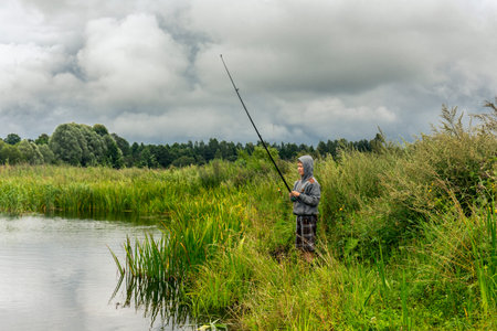 Teenboy fishing on the small river