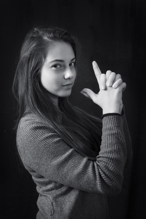 Monochrome close up emotional portrait of young beautiful girlの写真素材