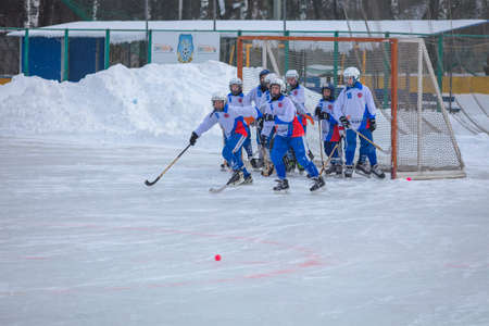 RUSSIA, KOROLEV - JANUARY 22, 2017: 3-d stage of Childrens hockey League bandy. BC Vympel - BC Filimonovoのeditorial素材