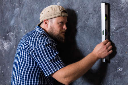 Solid bearded foreman with a plumbの写真素材