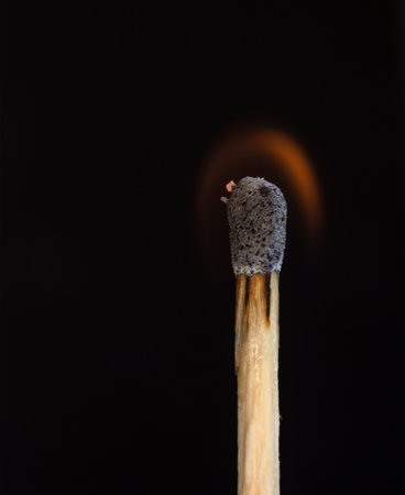 Macrophotography of burning match close up view.