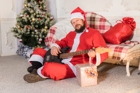 Bearded man dressed in Santa Claus costumeの写真素材