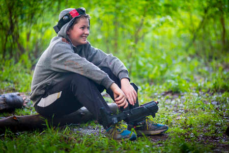 Teenager has a rest after the laser tagの写真素材