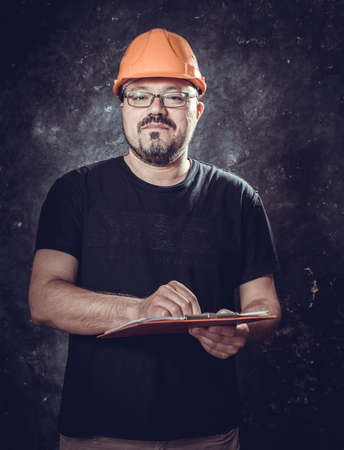 Middle-aged man in a helmet construction superintendentの写真素材