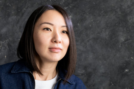 Beautiful korean woman close up view studio portrait.の写真素材