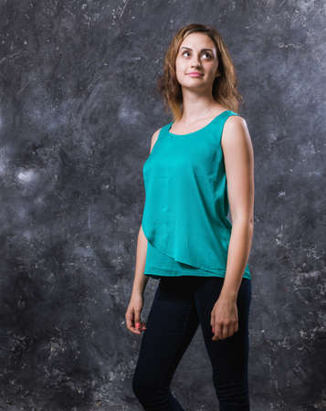 Pretty young woman dressed in green shirtの写真素材