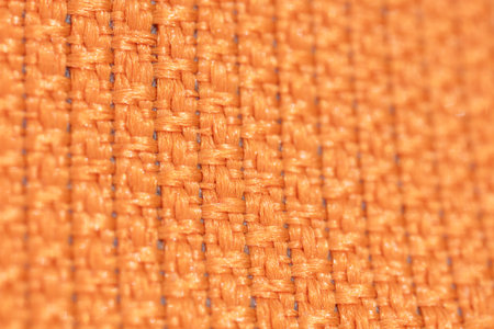 Macrophotography of fabric texture abstract background close up view.