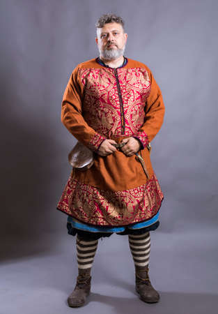 Mature bearded man in traditional historic clothesの写真素材