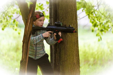 Girl with a gun playing laser tag