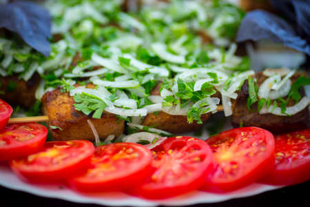 Served tasty meal wth tomatoes and barbeque close up viewの写真素材