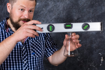 Solid bearded foreman with a plumb studio portrait.