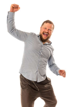 Joyful bearded man in shirt is happy to winの写真素材
