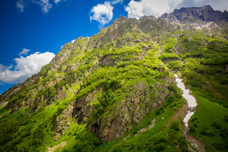 Beautiful mountain landscape with green grass at Caucasus mountainsの写真素材