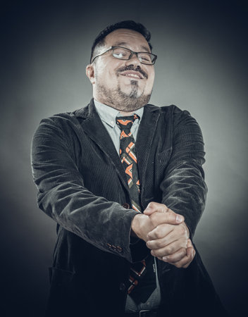 Solid cheerful man in spectacles emotional portraitの写真素材